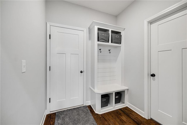 1296 NW Lindenwood Dr, Grain Valley, MO 64029 - mudroom featuring baseboards and dark wood-style flooring