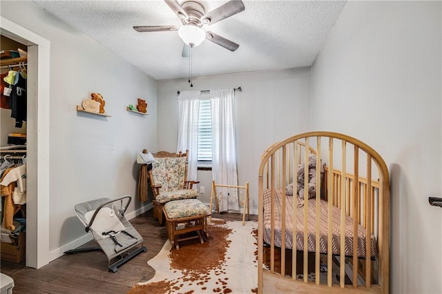 4252 SE Valleyview Ln, Holt, MO 64048 - bedroom with a textured ceiling, wood finished floors, and ceiling fan