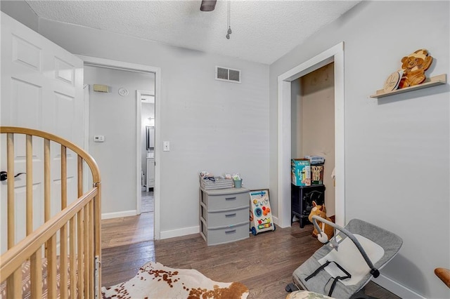 4252 SE Valleyview Ln, Holt, MO 64048 - living area featuring wood finished floors and a textured ceiling