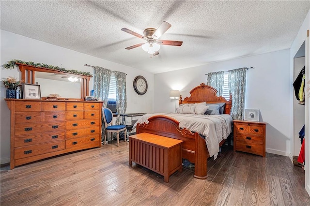4252 SE Valleyview Ln, Holt, MO 64048 - bedroom with hardwood / wood-style flooring, multiple windows, a textured ceiling, and ceiling fan