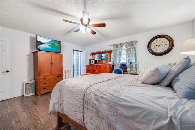 4252 SE Valleyview Ln, Holt, MO 64048 - bedroom with dark wood-type flooring, a textured ceiling, and a ceiling fan