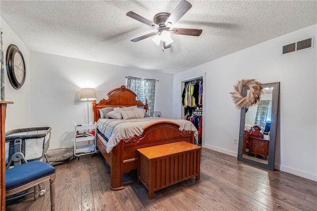 4252 SE Valleyview Ln, Holt, MO 64048 - bedroom with a textured ceiling, wood finished floors, and a ceiling fan