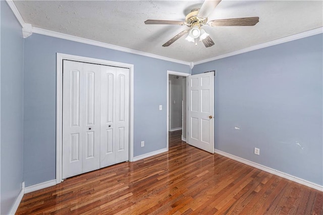 2518 Arrowhead Rd, Topeka, KS 66614 - unfurnished bedroom with wood finished floors, a closet, crown molding, and ceiling fan