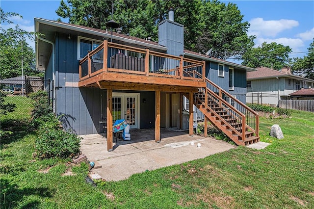 2518 Arrowhead Rd, Topeka, KS 66614 - rear view of property with french doors, a wooden deck, a chimney, a patio, and stairs