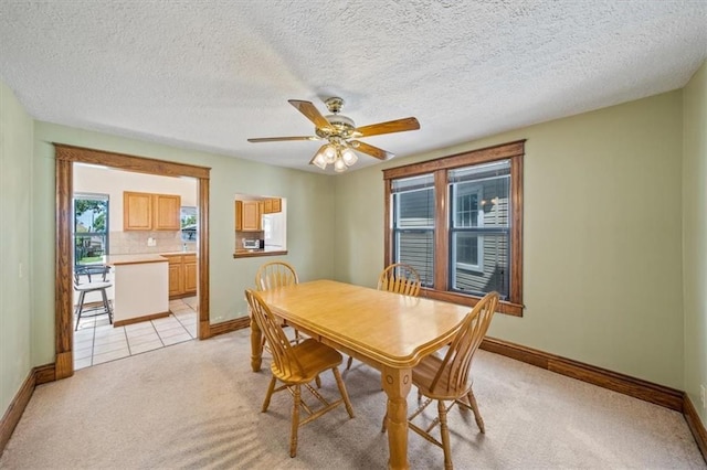 362 S 10th St, Kansas City, KS 66102 - dining room with light carpet and ceiling fan