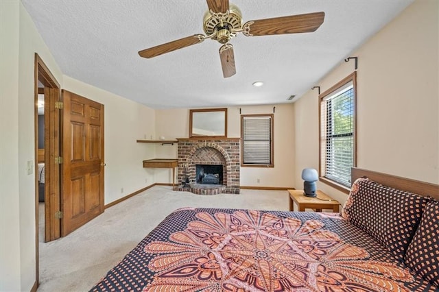 362 S 10th St, Kansas City, KS 66102 - bedroom with carpet, a textured ceiling, a fireplace, and ceiling fan