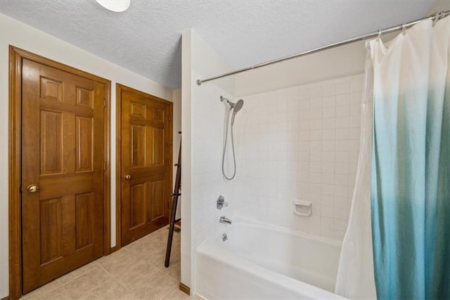362 S 10th St, Kansas City, KS 66102 - bathroom with shower / tub combo with curtain, tile patterned floors, and a textured ceiling