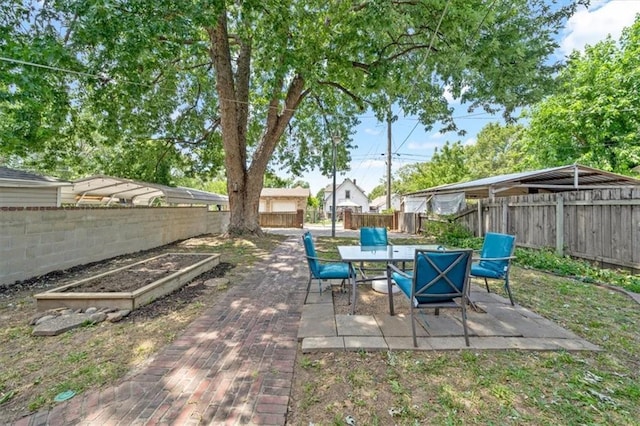 362 S 10th St, Kansas City, KS 66102 - fenced backyard featuring a patio area