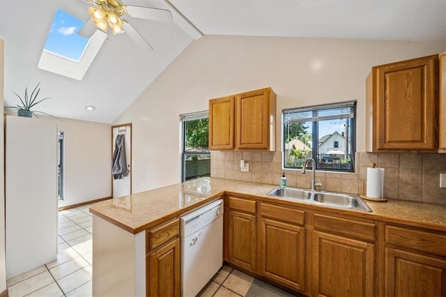 362 S 10th St, Kansas City, KS 66102 - kitchen with dishwasher, a peninsula, a skylight, vaulted ceiling, and brown cabinets