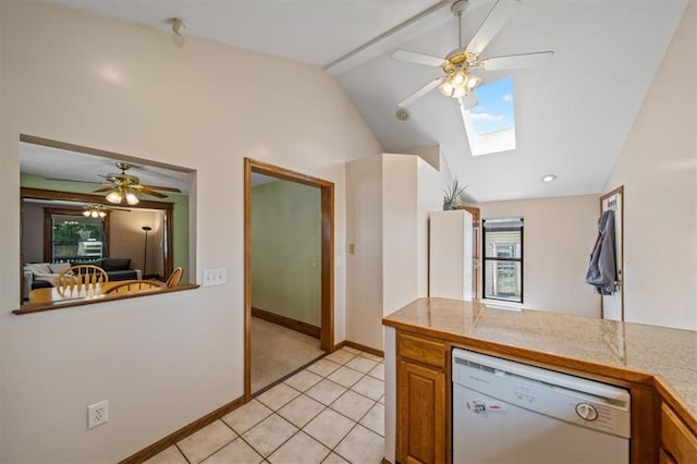 362 S 10th St, Kansas City, KS 66102 - kitchen with white dishwasher, lofted ceiling, ceiling fan, tile counters, and brown cabinetry