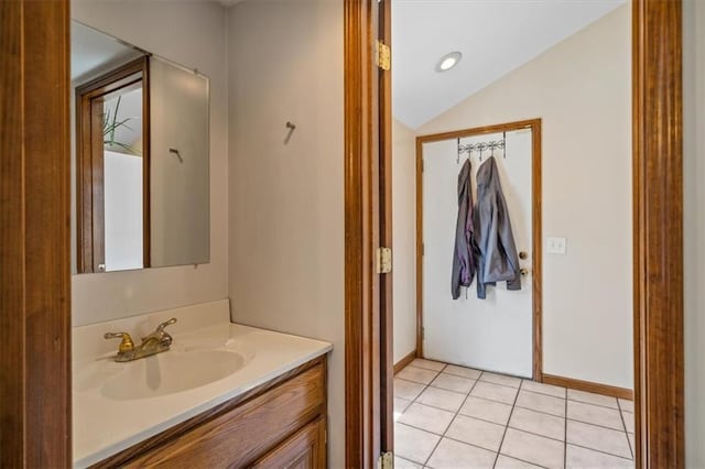 362 S 10th St, Kansas City, KS 66102 - bathroom featuring vanity, lofted ceiling, and tile patterned flooring