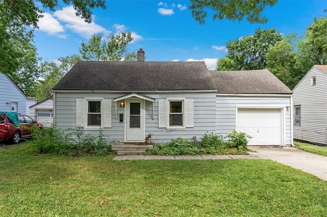 733 S Chestnut St, Olathe, KS 66061 - view of front of property with a garage, a chimney, concrete driveway, and a front yard