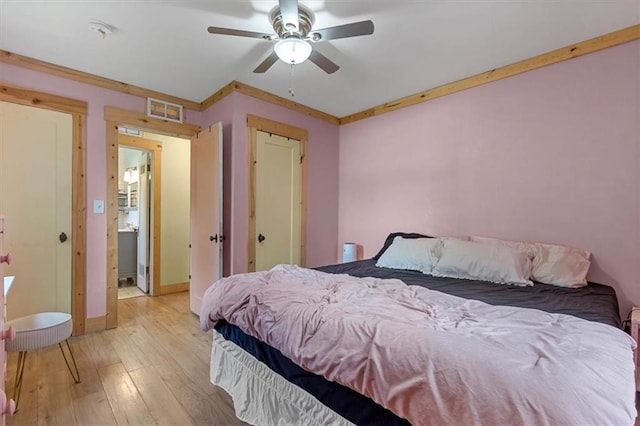 733 S Chestnut St, Olathe, KS 66061 - bedroom featuring wood-type flooring and a ceiling fan