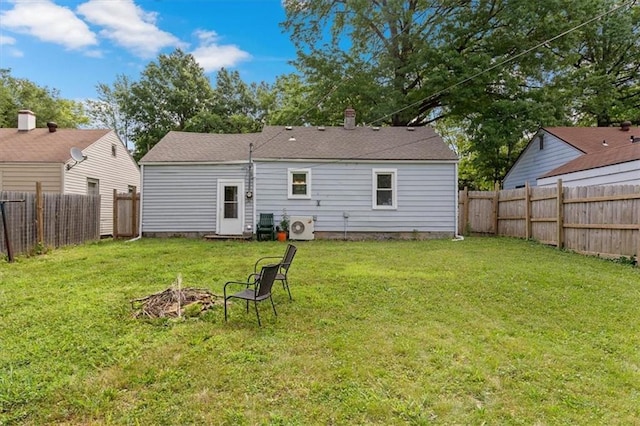 733 S Chestnut St, Olathe, KS 66061 - rear view of house featuring a fenced backyard and a fire pit