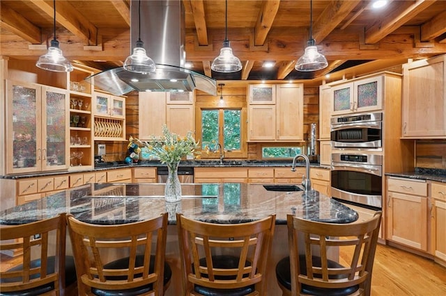 389 NW 1851st Rd, Kingsville, MO 64061 - kitchen with island exhaust hood, light wood-style floors, a wood ceiling with exposed beams, and light brown cabinets