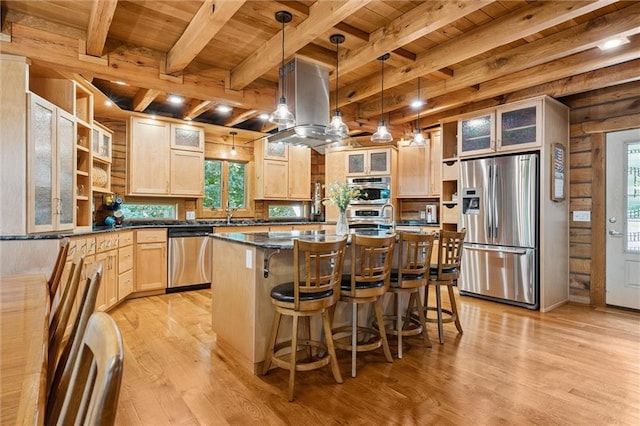 389 NW 1851st Rd, Kingsville, MO 64061 - kitchen with stainless steel appliances, a wood ceiling with exposed beams, light brown cabinets, light wood-style flooring, and a center island with sink