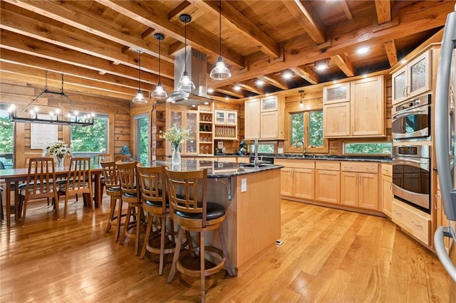 389 NW 1851st Rd, Kingsville, MO 64061 - kitchen with a wooden ceiling with exposed beams, light wood-style floors, light brown cabinets, and an island with sink