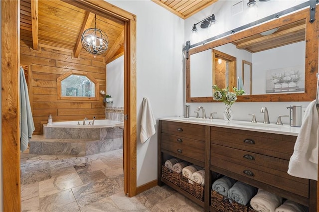 389 NW 1851st Rd, Kingsville, MO 64061 - full bathroom with wood ceiling, a bath, double vanity, stone finish flooring, and wood walls