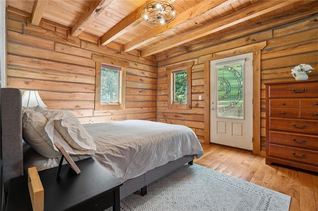 389 NW 1851st Rd, Kingsville, MO 64061 - bedroom featuring a wooden ceiling with exposed beams, light wood-style floors, and wood walls