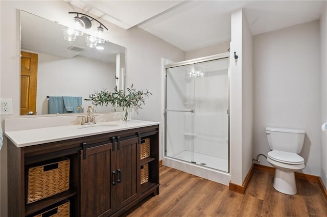 389 NW 1851st Rd, Kingsville, MO 64061 - full bath featuring wood finished floors, vanity, and a shower stall