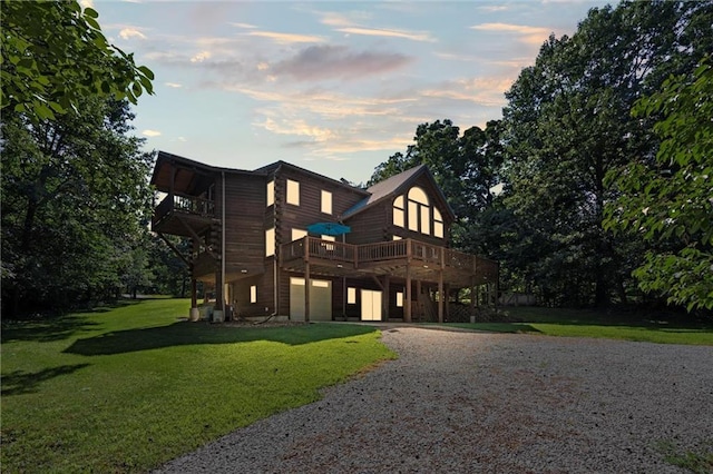 389 NW 1851st Rd, Kingsville, MO 64061 - view of front of property with driveway, a lawn, a garage, and a deck
