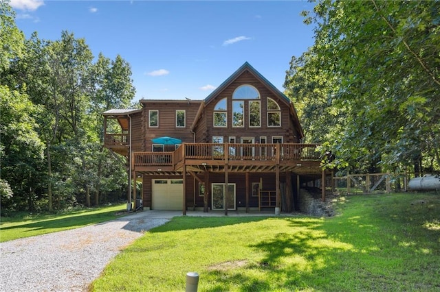 389 NW 1851st Rd, Kingsville, MO 64061 - rear view of property featuring driveway, a garage, a wooden deck, and a yard