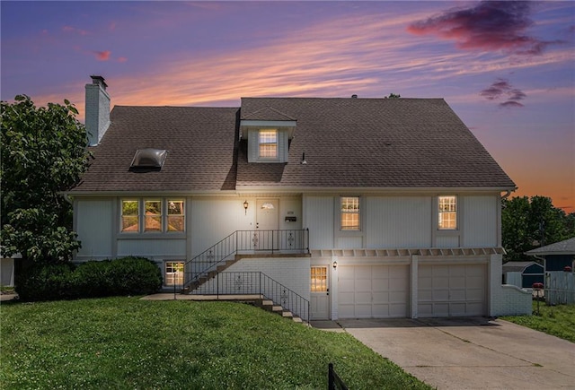 12731 Byars Rd, Grandview, MO 64030 - view of front of house with a chimney, an attached garage, a front lawn, driveway, and a shingled roof