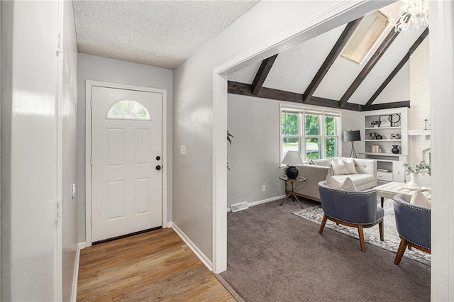 12731 Byars Rd, Grandview, MO 64030 - entrance foyer featuring a textured ceiling and wood finished floors