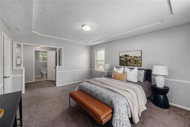 12731 Byars Rd, Grandview, MO 64030 - bedroom featuring a textured ceiling, carpet flooring, and multiple windows