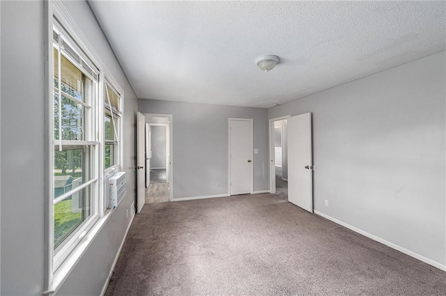 12731 Byars Rd, Grandview, MO 64030 - carpeted spare room featuring baseboards and a textured ceiling