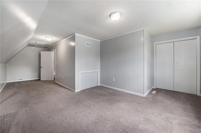 12731 Byars Rd, Grandview, MO 64030 - bonus room with carpet, a textured ceiling, and vaulted ceiling