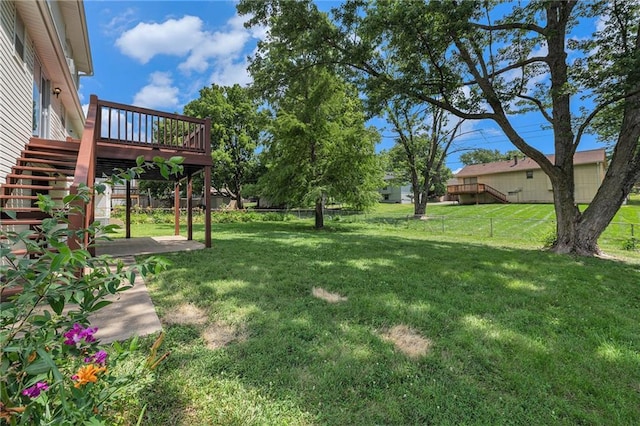 12731 Byars Rd, Grandview, MO 64030 - fenced backyard featuring stairway and a deck