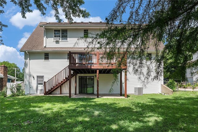 12731 Byars Rd, Grandview, MO 64030 - back of house featuring a deck, stairway, a shingled roof, and a patio area