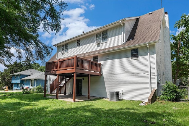 12731 Byars Rd, Grandview, MO 64030 - back of house featuring stairway, a wooden deck, and a patio