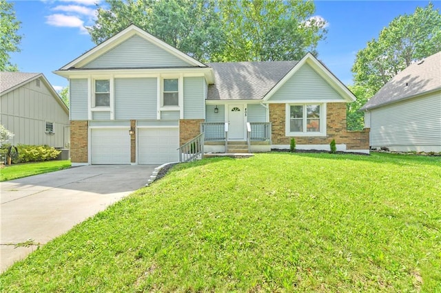 805 NW 18th St, Blue Springs, MO 64015 - split level home featuring brick siding, an attached garage, driveway, and a front lawn