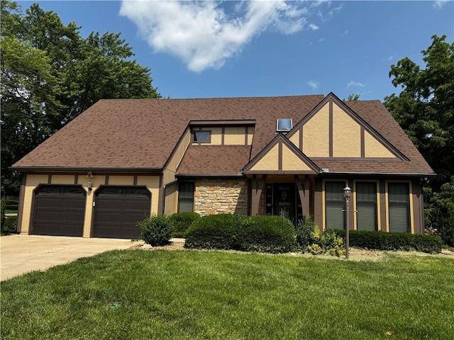 4008 NE 57th Ter, Kansas City, MO 64119 - view of front facade with driveway, an attached garage, a front lawn, stucco siding, and stone siding