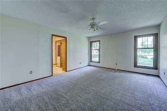 4008 NE 57th Ter, Kansas City, MO 64119 - unfurnished room with carpet, a ceiling fan, and a textured ceiling