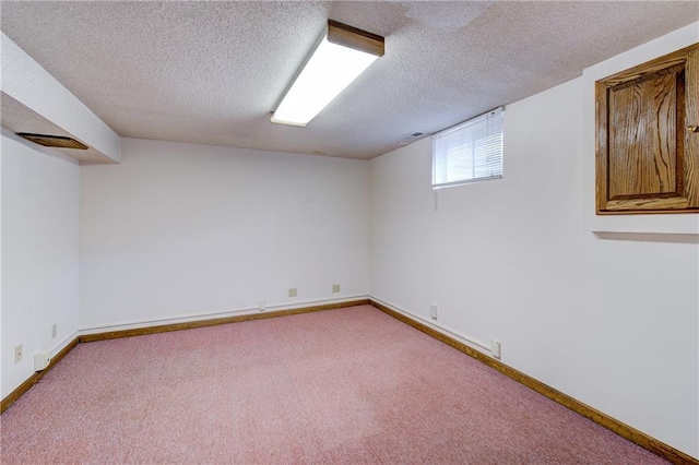 4008 NE 57th Ter, Kansas City, MO 64119 - below grade area with a textured ceiling and carpet
