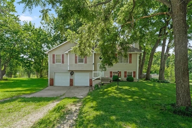 15509 Lawrence Ave, Belton, MO 64012 - view of front of house with driveway, an attached garage, and a front lawn