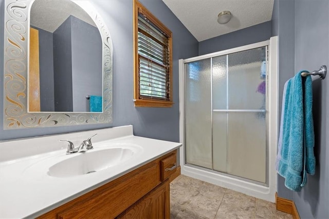 15509 Lawrence Ave, Belton, MO 64012 - bathroom with vanity, a shower stall, and a textured ceiling