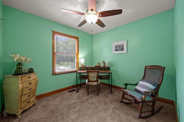 15509 Lawrence Ave, Belton, MO 64012 - sitting room featuring a textured ceiling, ceiling fan, and carpet floors