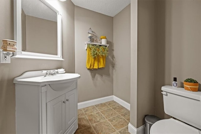 15509 Lawrence Ave, Belton, MO 64012 - bathroom featuring vanity and a textured ceiling