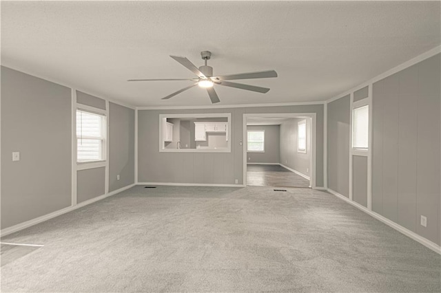 8167 NE 50th St, Kansas City, MO 64119 - carpeted spare room with crown molding, ceiling fan, and healthy amount of natural light
