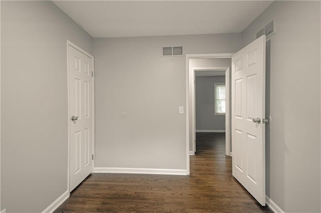 8167 NE 50th St, Kansas City, MO 64119 - corridor with dark wood-style floors