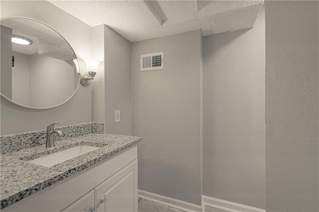 8167 NE 50th St, Kansas City, MO 64119 - bathroom featuring vanity and a textured ceiling