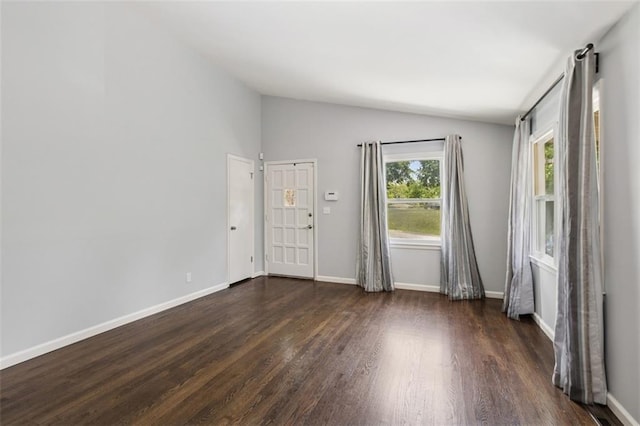 4112 N Hardesty Ave, Kansas City, MO 64117 - empty room featuring dark wood-type flooring and lofted ceiling