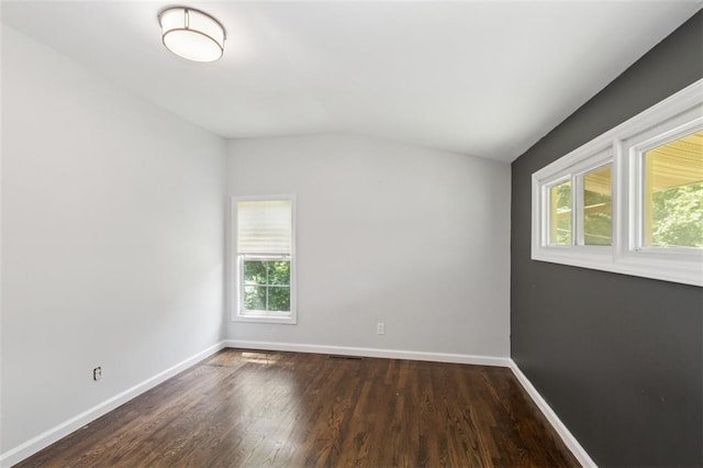 4112 N Hardesty Ave, Kansas City, MO 64117 - spare room with vaulted ceiling and wood finished floors