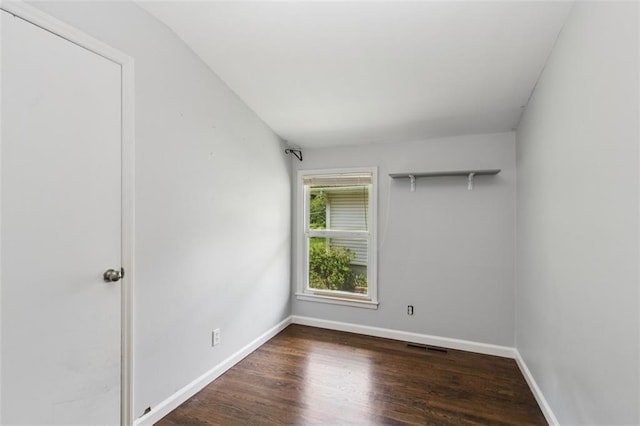 4112 N Hardesty Ave, Kansas City, MO 64117 - unfurnished room with baseboards and wood finished floors