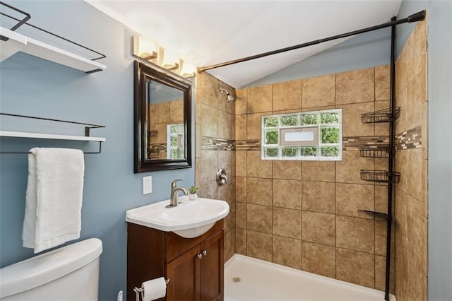 4112 N Hardesty Ave, Kansas City, MO 64117 - full bath featuring vaulted ceiling, vanity, and tiled shower