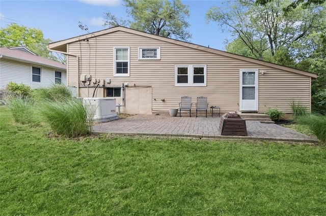 4112 N Hardesty Ave, Kansas City, MO 64117 - rear view of house with a lawn and a patio